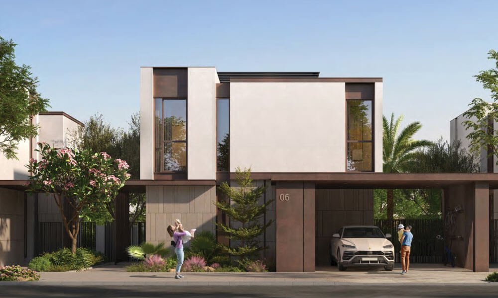 Home front with a covered carport, a white car and a parent carrying a child at Delphi, Athlon in Dubailand.